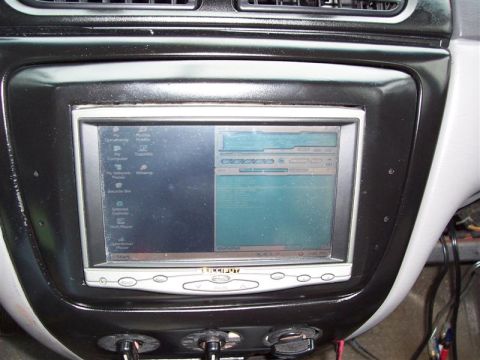 2001 Ford Taurus - Close-up of an aftermarket car computer screen with various icons and a program window visible.