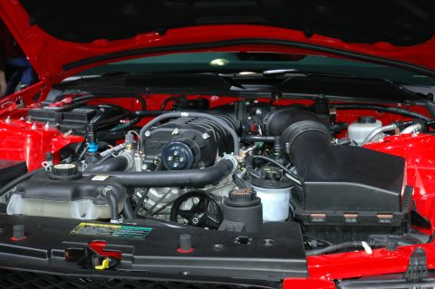 2005 Ford Mustang - Engine bay of a 2005 Ford Mustang, a prominent supercharger.