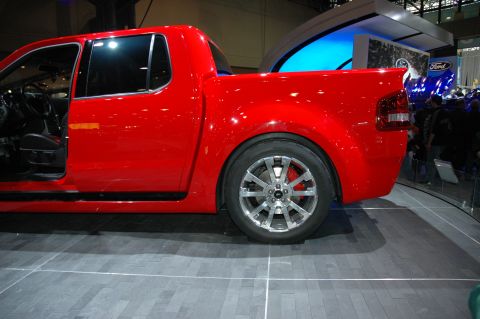 2005 Ford Mustang - This red pickup truck appears to be a 2006 model, not a 2005 Ford Mustang.
