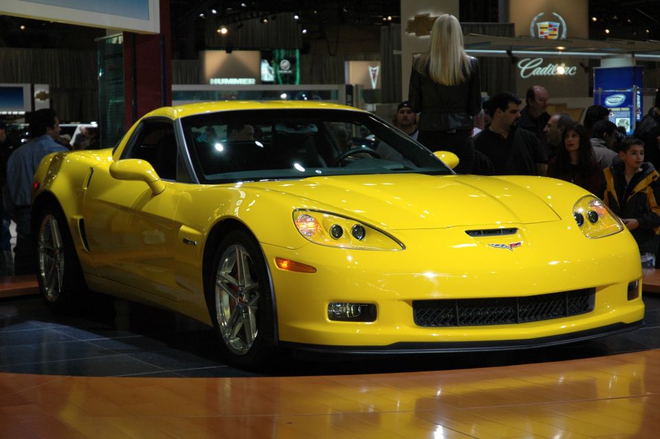 Yellow Chevrolet Corvette on display indoors