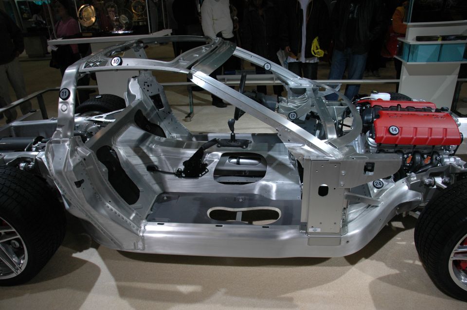 Car chassis with red engine and numbered parts