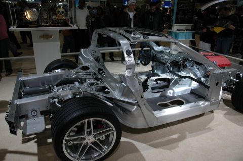 2005 Ford Mustang - Exposed car chassis on display, revealing its internal structure and components.