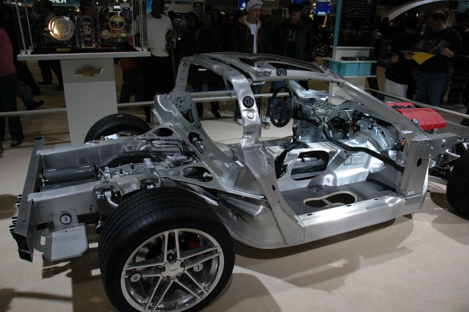 Aluminum chassis of a car, showing suspension and interior frame