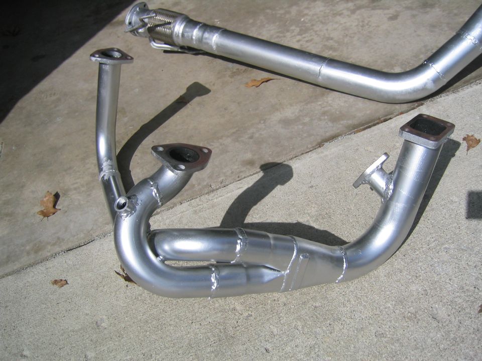 exhaust manifold and pipe sections on concrete