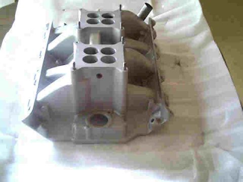 1963 Ford Galaxie - This engine intake manifold features a four-barrel carburetor mounting configuration.
