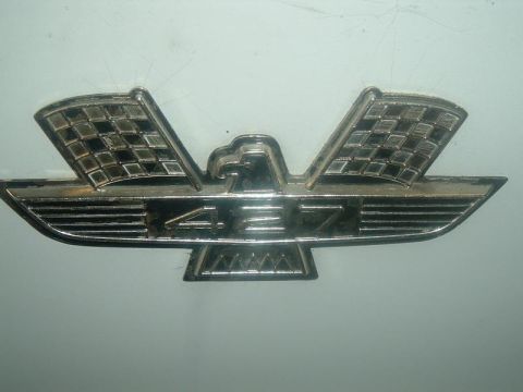 1963 Ford Galaxie - This emblem reads 427 and features an eagle with checkered flags, likely indicating a performance package.