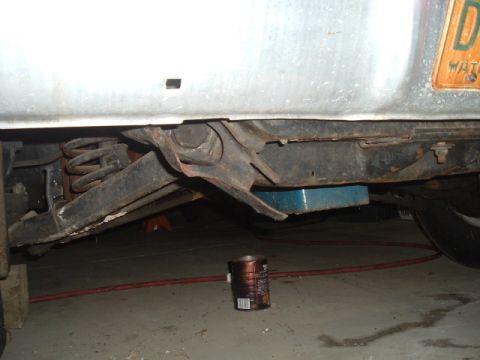 1963 Ford Galaxie - Undercarriage view of a 1963 Ford Galaxie, revealing its rear suspension and frame components.