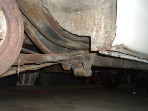 1963 Ford Galaxie - Underside view shows the rear leaf spring suspension system with visible rust.