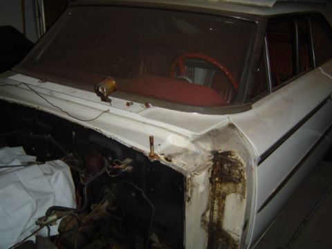1963 Ford Galaxie - Front view of a white 1963 Ford Galaxie undergoing restoration, showing the interior and open engine bay.