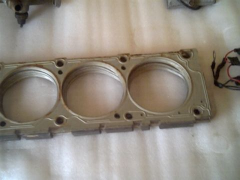 1963 Ford Galaxie - This engine cylinder head gasket features three prominent bores and is part of a "Parts for sale" listing.