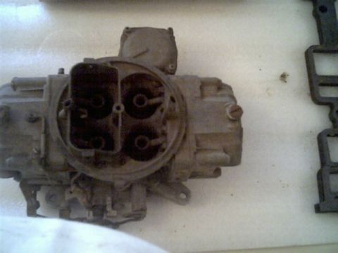 1963 Ford Galaxie - Carburetor part shown on a white surface.