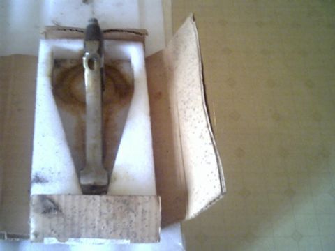1963 Ford Galaxie - A metal component is shown inside its protective packaging, ready for shipment or storage.
