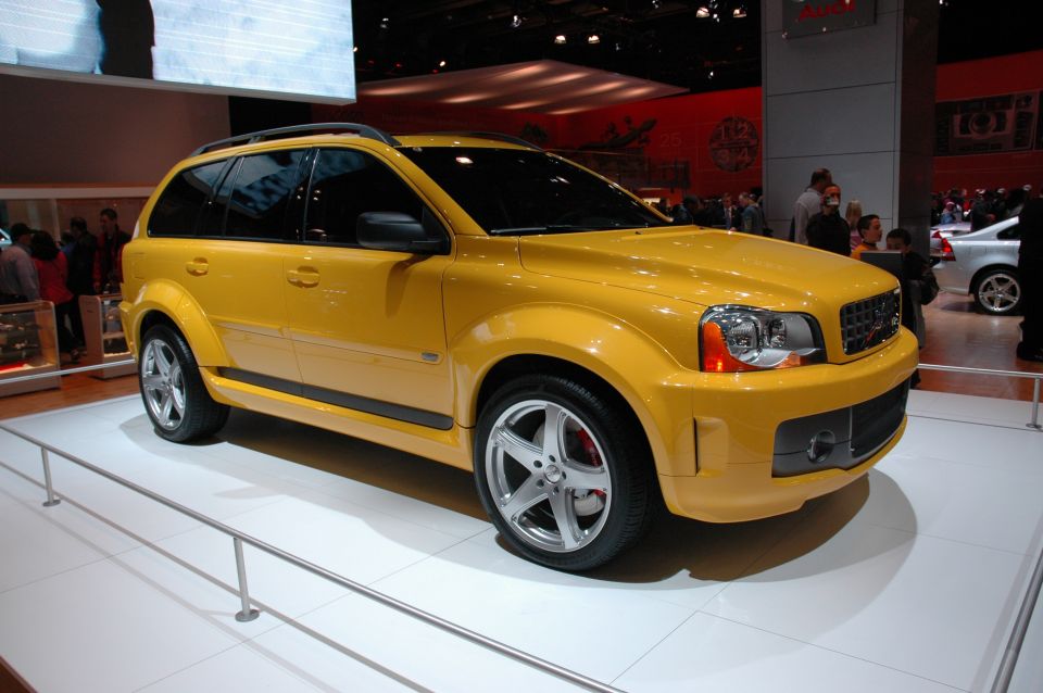 Yellow SUV on display at an auto show