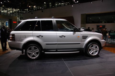2005 Ford Mustang - Side view of a silver Range Rover Sport SUV at an auto show.
