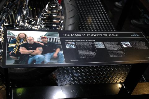 2005 Ford Mustang - A sign describes The Mark LT Chopper by O.C.C. and features a photo of three men.