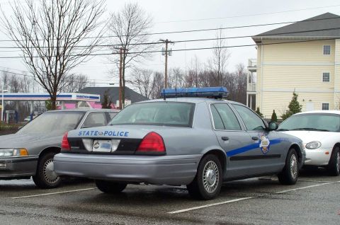 1998 Ford Crown Victoria - This 1998 Ford Crown Victoria police car is seen from the rear, displaying "STATE POLICE" on its trunk lid.