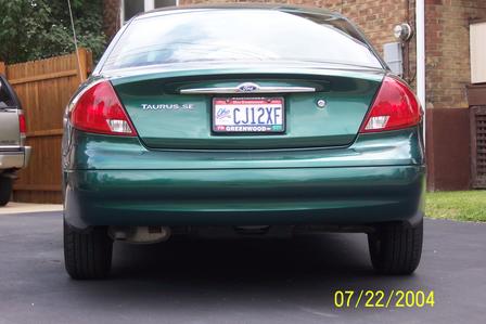 2000 Ford Taurus - Rear view of a green 2000 Ford Taurus SE, identified by its taillights and body style.
