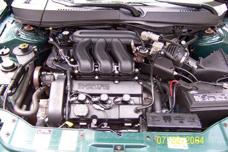 2000 Ford Taurus - Engine bay of a 2000 Ford Taurus, showing the Duratec V6 engine.