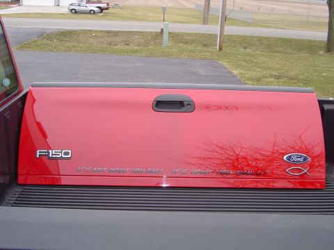 1978 Ford Bronco - Red Ford F-150 tailgate with text and Ford logo is shown.
