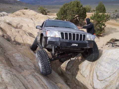 1989 Ford Bronco - A Jeep Grand Cherokee tackles a challenging rock crawling course during Spring Break 2005.