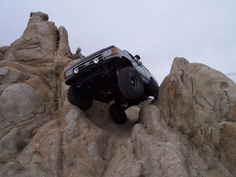 1989 Ford Bronco - This 1989 Ford Bronco navigates a challenging rocky terrain, its off-road capabilities.