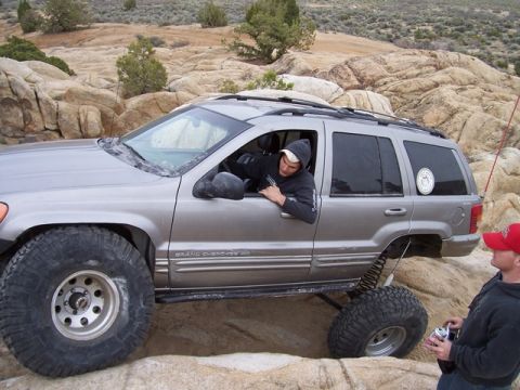 1989 Ford Bronco - This modified Jeep Grand Cherokee navigates a rocky trail with a driver and observer present.