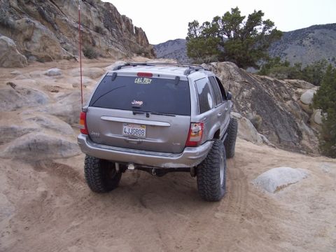 1989 Ford Bronco - This Jeep Grand Cherokee navigates a challenging off-road course, its modified suspension and tires.