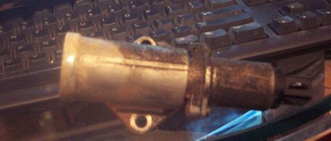 1985 Ford LTD Crown Victoria - An idle air control valve is shown on a keyboard, not a 1985 Ford Crown Victoria LTD.