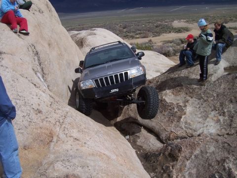 1989 Ford Bronco - A Jeep Grand Cherokee navigates a rocky trail during Spring Break 2005.