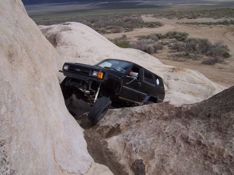 1989 Ford Bronco - A black 1989 Ford Bronco navigates a rocky trail during Spring Break 2005.