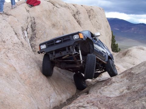 1989 Ford Bronco - This 1989 Ford Bronco navigates a challenging rocky incline during an off-road excursion.