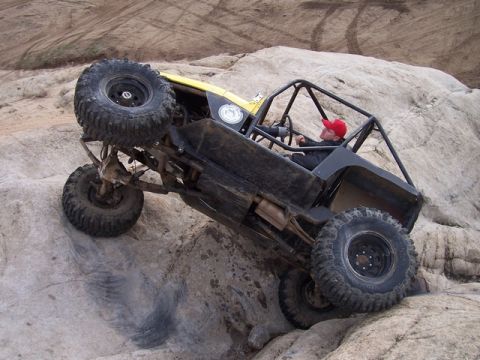 1989 Ford Bronco - Custom buggy navigates difficult rocky terrain during an off-road excursion.