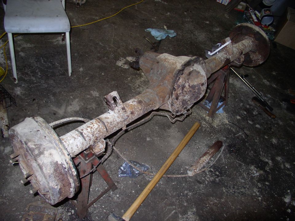 Sway bar and brackets off. Shocks off as well, just brake lines to get rid of now.