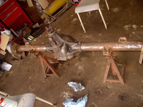 1986 Ford Bronco - Scraped and ground down the axle of loose dirt and most rust.