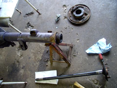 1986 Ford Bronco - Out comes that axle and off comes the brake backing plate.