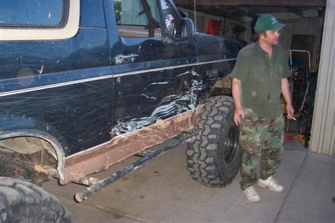 1994 Ford Bronco - Ford Bronco shows significant damage to the driver's side door and fender area.