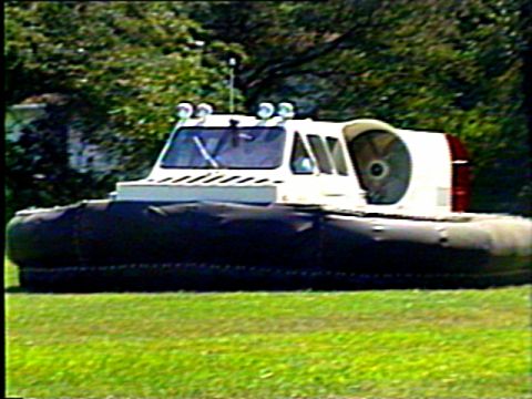 1972 Ford Bronco - A hovercraft is pictured from the side, showing its large rear fan and inflatable skirt.