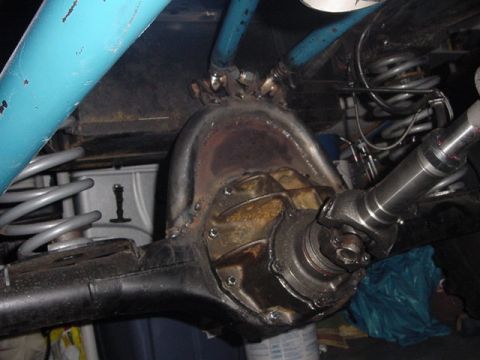 1971 Ford Bronco - Close-up view of a vehicle's rear differential and driveshaft assembly, showing suspension components.