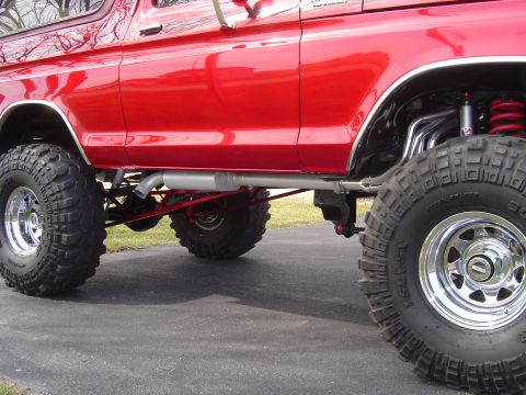 1978 Ford Bronco - This lifted 1978 Ford Bronco features a bright red exterior and aggressive off-road tires.