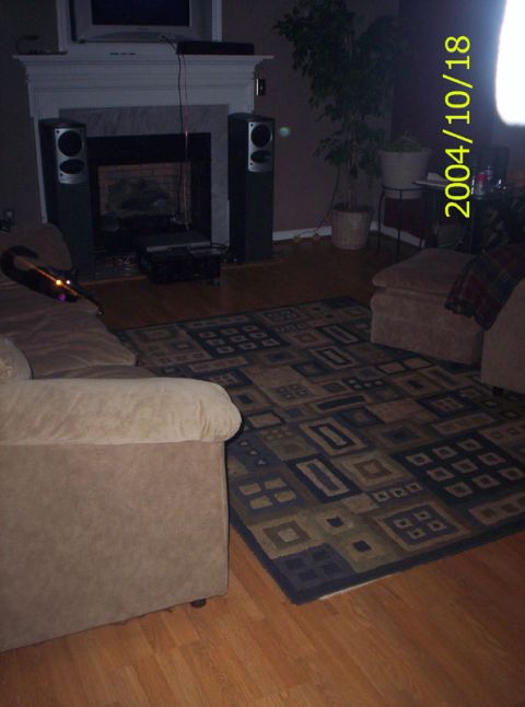 1986 Ford Bronco - Interior view of a living room a fireplace, audio speakers, and furniture.