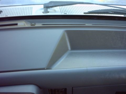 1990 Ford Bronco - Interior view of a 1990 Ford Bronco dashboard, focusing on the passenger side panel.
