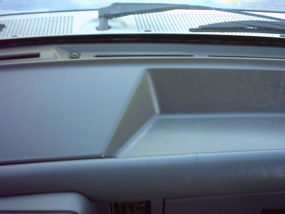 Dashboard of a 1990 Ford Bronco, showing the passenger side dash panel and air vents