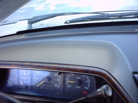 1990 Ford Bronco - Interior view of a 1990 Ford Bronco dashboard with gauges and wipers visible.