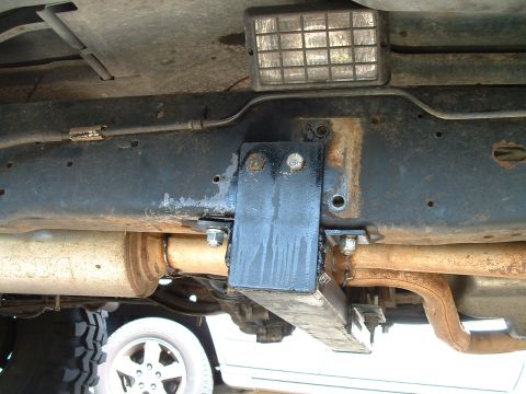 1995 Ford Bronco - Undercarriage view of a 1995 Ford Bronco, highlighting the trailer hitch and exhaust components.