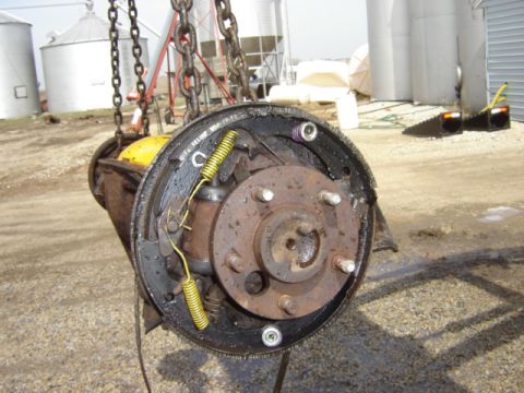 1992 Ford Bronco - A brake drum assembly, likely from a truck or SUV, is shown suspended by chains. The registry claims it is from a 1992 Ford Bronco, but thi…