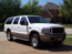 2004 Ford Excursion - This large SUV is parked outdoors on a sunny day.
