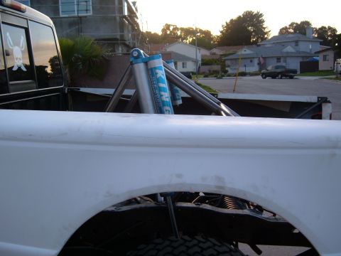 2002 Ford Ranger - Custom suspension components are visible in the bed of a white pickup truck.