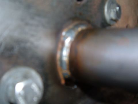 2002 Ford Ranger - Close-up view of a welded exhaust pipe section, showing metalwork and fasteners.