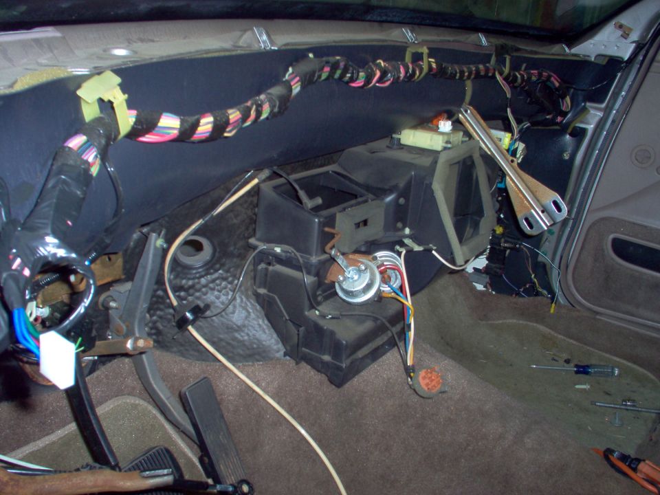 The new branch off the firewall harness with the white plug is the RKE wiring into the lock circuit.  It will plug into the module below the autolamp sensor.