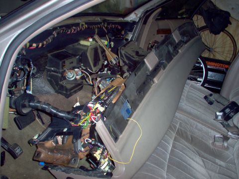 1994 Ford Crown Victoria - The dash is finally going back in. Its harness on the R side is visible just below the paddle-shaped brace.